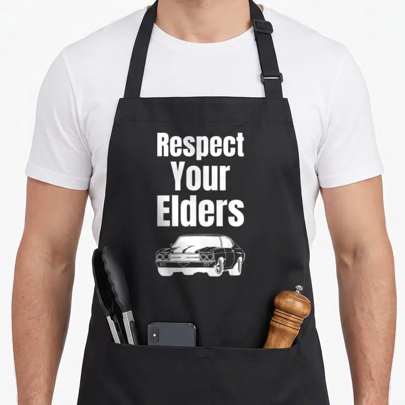 Respect muscle apron - White stacked text reading Respect Your Elders above a line-art muscle car — shown on a black cotton canvas apron against a white background