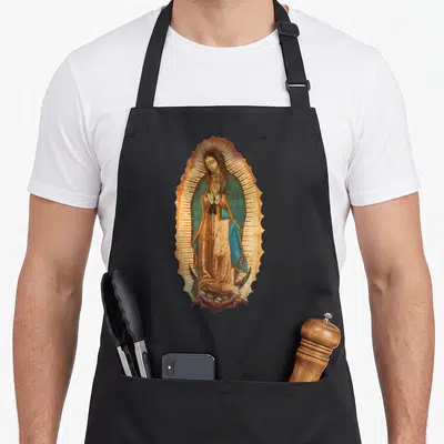 Virgen our lady of guadalupe apron - Realistic Virgin Mary in blue and brown robes standing on a crescent moon inside — shown on a black cotton canvas apron against a white background