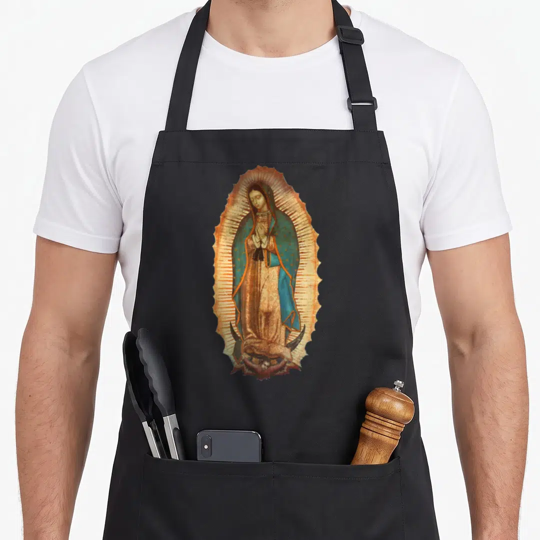 Virgen our lady of guadalupe apron - Realistic Virgin Mary in blue and brown robes standing on a crescent moon inside — shown on a black cotton canvas apron against a white background