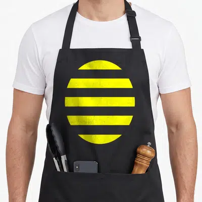 Costume bee apron - Minimalist yellow circle divided into five horizontal grey-striped segments — shown on a black cotton canvas apron against a white background