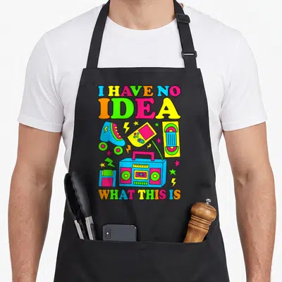 70s 80s 90s chef outfit with apron - Neon retro boombox, roller skate, and cassette tape with bold colorful lettering — shown on a black cotton canvas apron against a white background