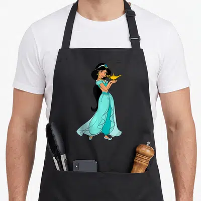 Magic princess apron - Cartoon woman in light blue dress holding a gold lamp — shown on a black cotton canvas apron against a white background