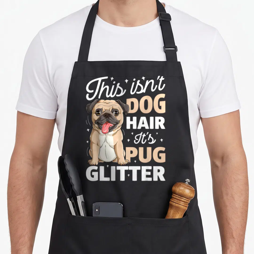Hair pug dog apron - Cartoon pug sitting with text This isn't Dog Hair It's Pug Glitter and stars — shown on a black cotton canvas apron against a white background