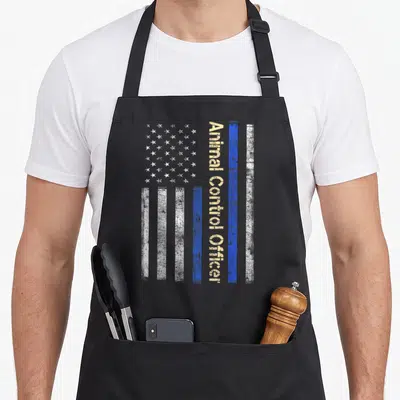 Animal american flag apron - Distressed vertical flag with blue stripe and vertical Animal Control Officer text — shown on a black cotton canvas apron against a white background