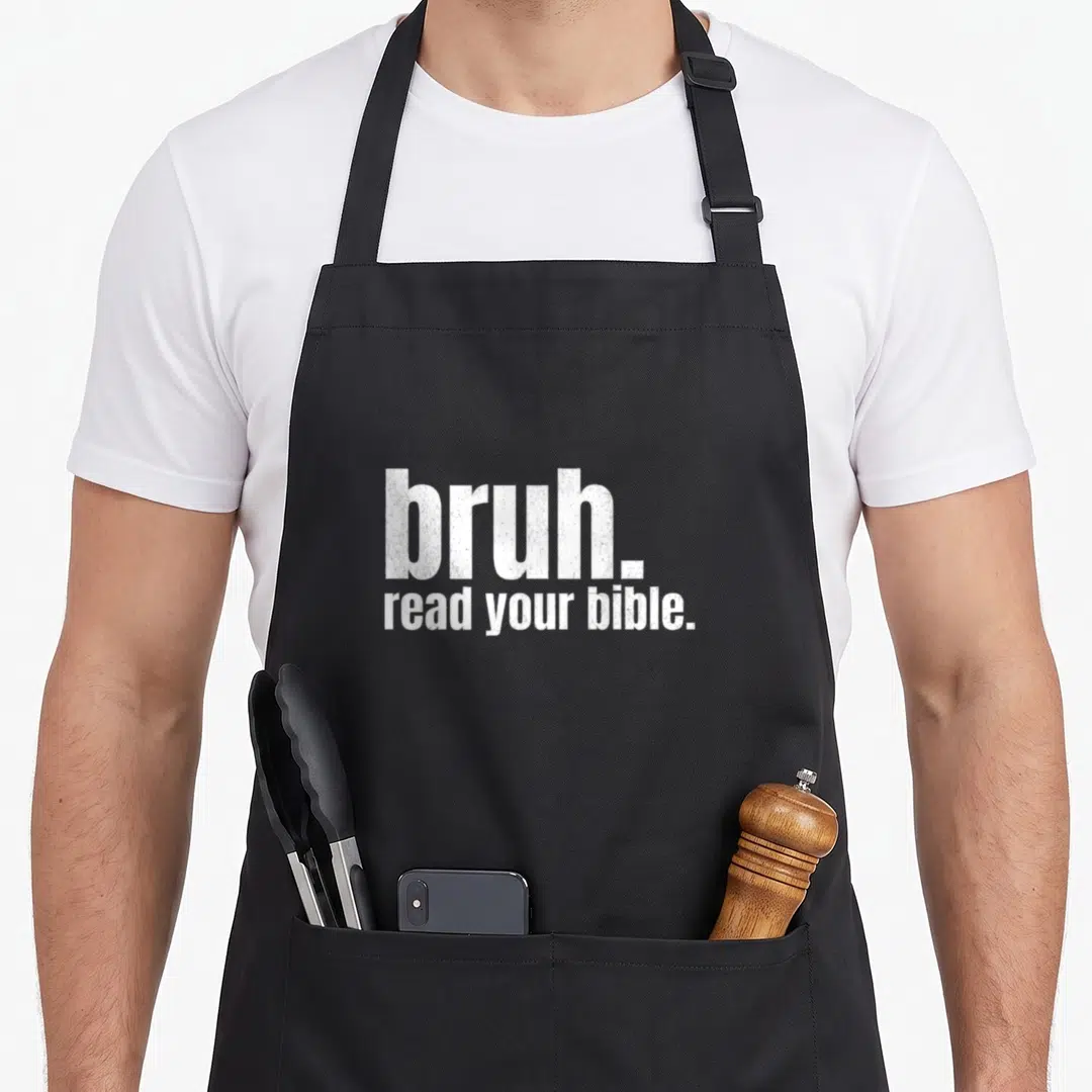Read meme apron - White stacked text reading bruh. read your bible. on grey background — shown on a black cotton canvas apron against a white background