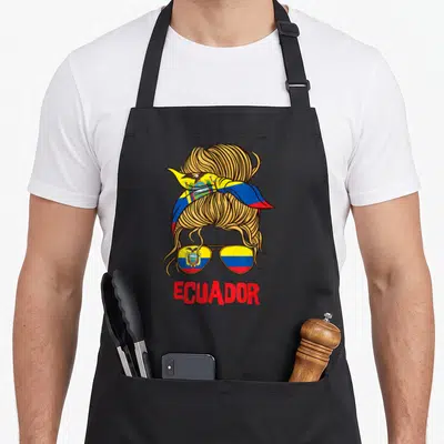 Ecuador ecuadorian boy apron - Messy bun with headband and aviator sunglasses reflecting the Ecuadorian flag in gold — shown on a black cotton canvas apron against a white background