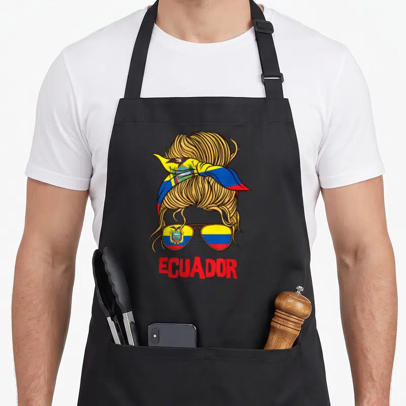 Ecuador ecuadorian boy apron - Messy bun with headband and aviator sunglasses reflecting the Ecuadorian flag in gold — shown on a black cotton canvas apron against a white background