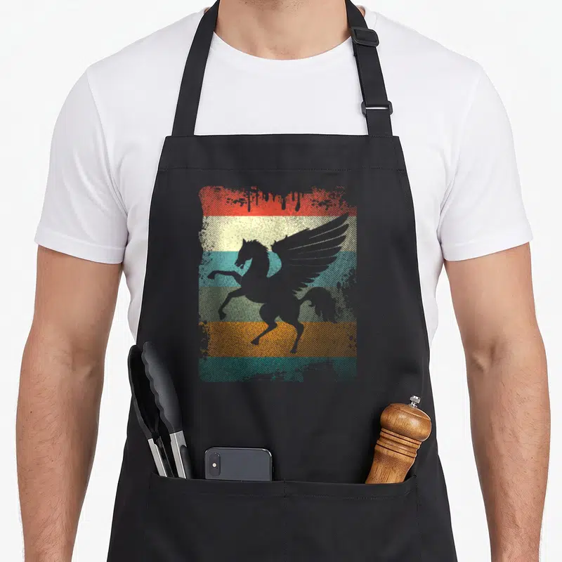 Pegasus greek aprons - Grey pegasus silhouette over red yellow blue green orange distressed stripes — shown on a black cotton canvas apron against a white background