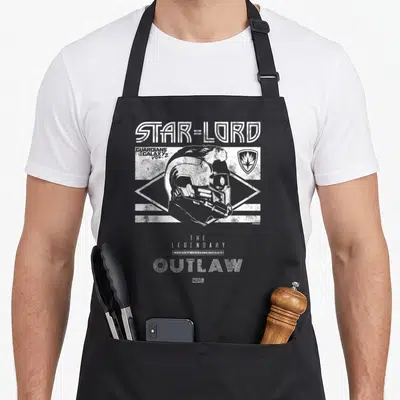 Lord stars nerd apron - Distressed Star-Lord helmet and The Legendary Outlaw text in white and grey — shown on a black cotton canvas apron against a white background