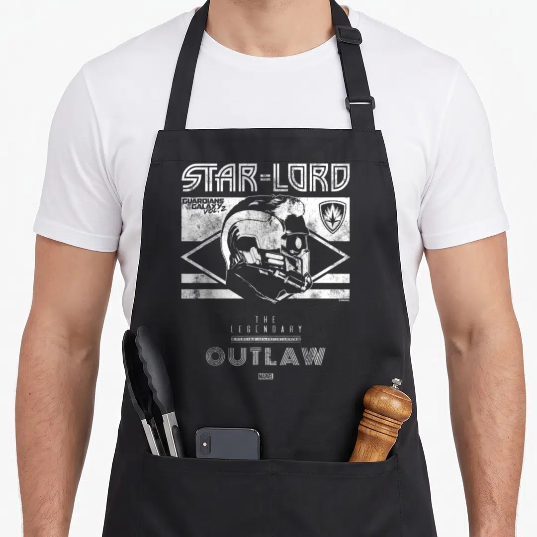 Lord stars nerd apron - Distressed Star-Lord helmet and The Legendary Outlaw text in white and grey — shown on a black cotton canvas apron against a white background
