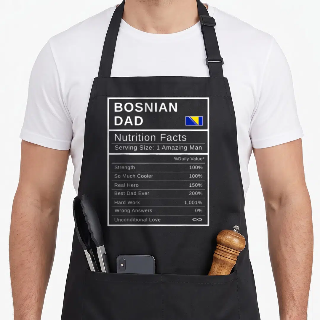Bosnian father day apron - Nutrition facts label graphic with Bosnian flag and text listing dad attributes like — shown on a black cotton canvas apron against a white background