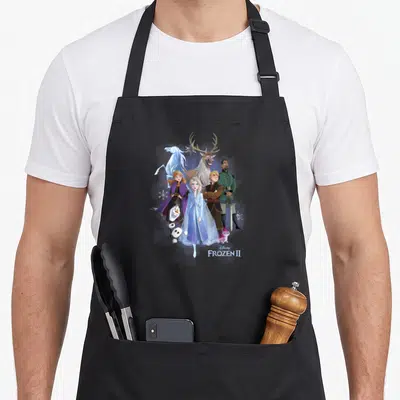 Shot walking apron - Elsa Anna Kristoff Olaf Sven and Gleno in blue purple and brown with Disney Frozen II text — shown on a black cotton canvas apron against a white background