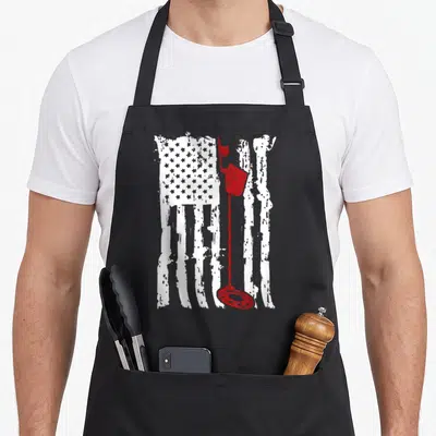 Metal american flag apron - Distressed white USA flag with red metal detector graphic overlay — shown on a black cotton canvas apron against a white background