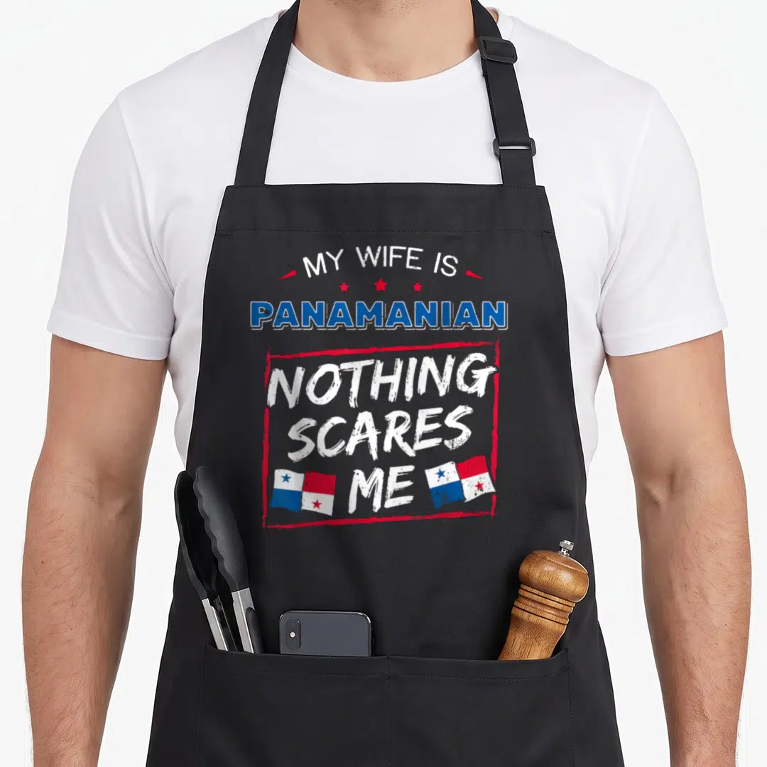 Panamanian wife apron - Stacked text MY WIFE IS PANAMANIAN NOTHING SCARES ME with two flags and distressed red border — shown on a black cotton canvas apron against a white background