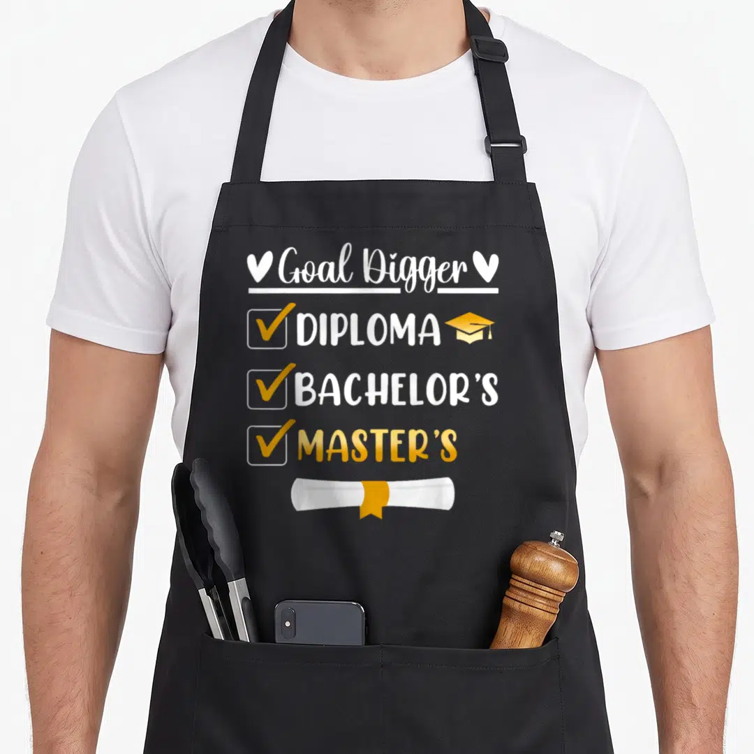 Goal master apron - Goal Digger text with checked boxes for Diploma, Bachelor's, and Master's degrees above a scroll — shown on a black cotton canvas apron against a white background