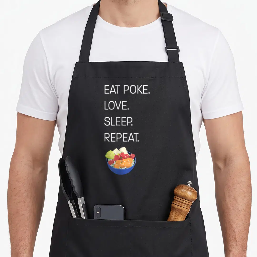 Eat hawaiian apron - Stacked white text EAT POKE LOVE SLEEP REPEAT above blue bowl with orange green and red food cubes — shown on a black cotton canvas apron against a white background