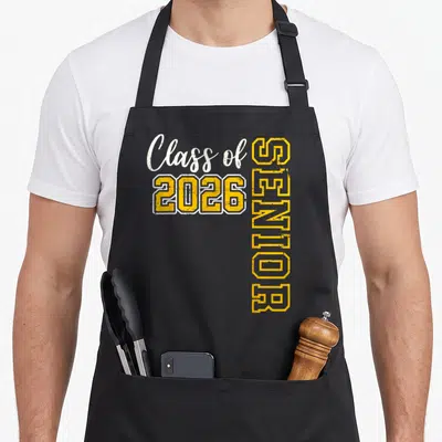 Class senior school graduation apron - Class of 2026 SENIOR yellow and white typography stacked design — shown on a black cotton canvas apron against a white background
