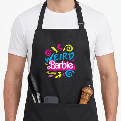 Cute weird aprons - Retro WEIRD Barbie text with pink blue yellow swirls and zigzags — shown on a black cotton canvas apron against a white background