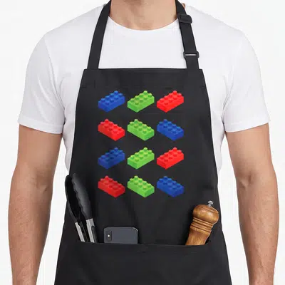 Brick master block & apron - Twelve blue green and red building blocks in a four by three grid pattern — shown on a black cotton canvas apron against a white background