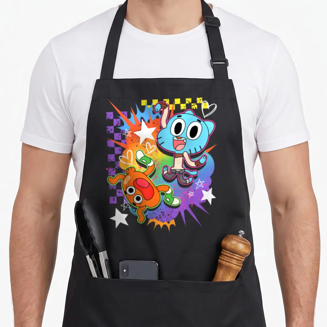Gumball darwin apron - Blue cat and orange fish on multi-colored splatter with stars and hearts — shown on a black cotton canvas apron against a white background