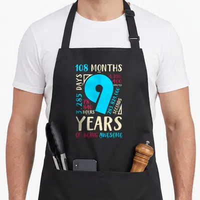 9th mom daughter aprons - Blue number 9 with red beige time stats and years of being awesome text — shown on a black cotton canvas apron against a white background