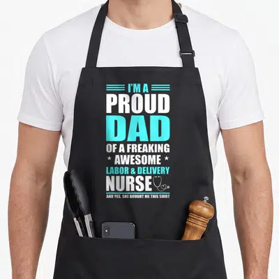 Freaking nurse apron - Stacked text proud dad nurse with cyan lines and white stethoscope graphic — shown on a black cotton canvas apron against a white background