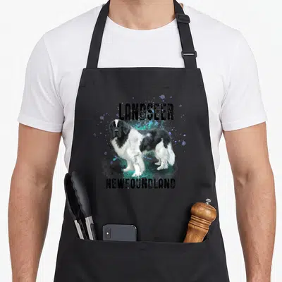 Brightly dog breed aprons - Realistic Landseer dog with blue teal splatters and LANDSEER NEWFOUNDLAND text — shown on a black cotton canvas apron against a white background