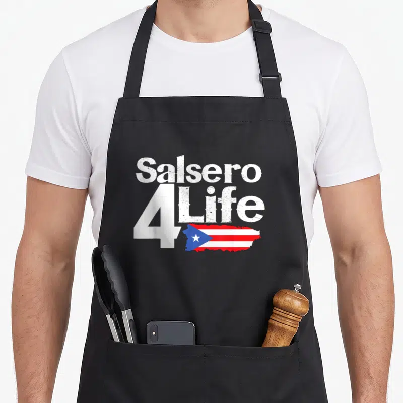 Salsa pride apron - Salsero 4Life text above Puerto Rico map flag in red white and blue distressed style — shown on a black cotton canvas apron against a white background