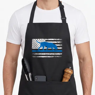 Bloodhound police apron - Blue dog silhouette over distressed blue and white American flag stripes and stars — shown on a black cotton canvas apron against a white background