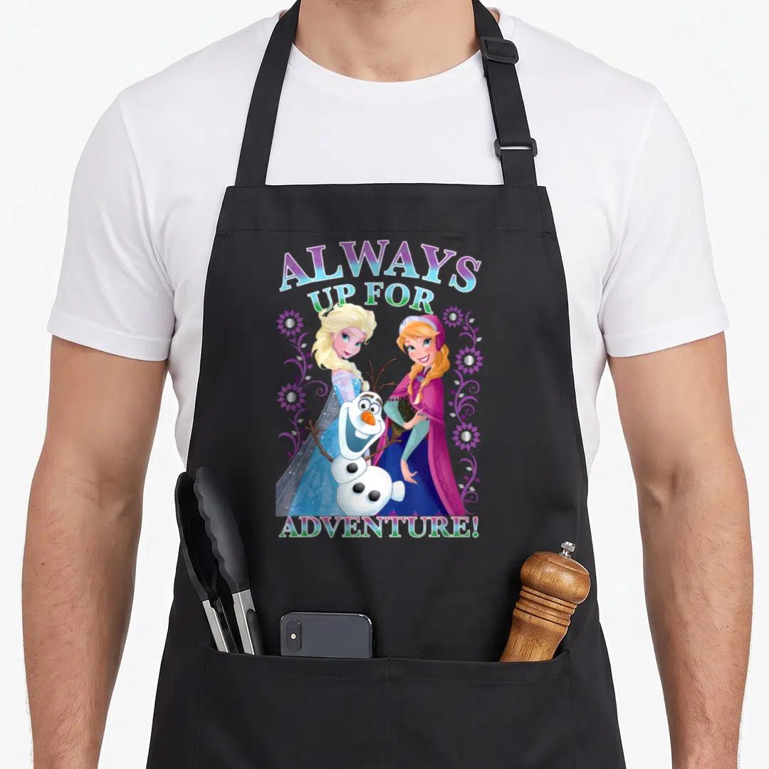 Alway frozen apron - Elsa Anna Olaf Always Up For Adventure text with purple floral vines — shown on a black cotton canvas apron against a white background