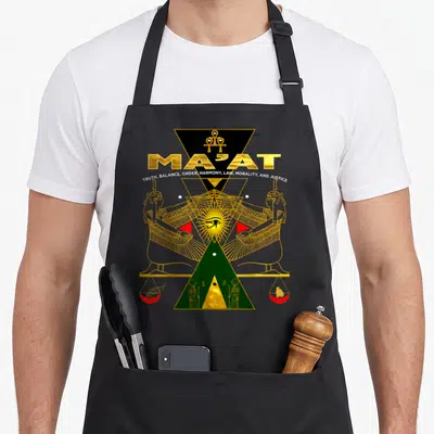 Sacred ancient egyptian apron - Ma'at text and mirrored deities over scales in gold and green geometric line art — shown on a black cotton canvas apron against a white background