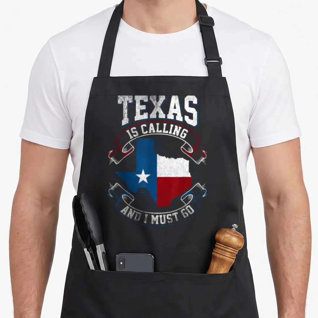 Texas state texans apron - Distressed Texas map with red and blue ribbons and white text — shown on a black cotton canvas apron against a white background