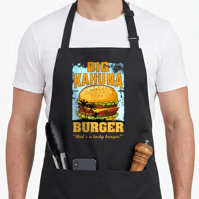 Hot food aprons - Retro burger with surfer silhouette and text that's a tasty burger — shown on a black cotton canvas apron against a white background