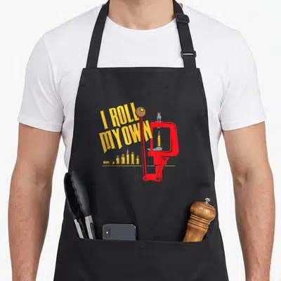 Patch patriots apron - Yellow I ROLL MY OWN text over red reloading press with bullets on bottom line — shown on a black cotton canvas apron against a white background