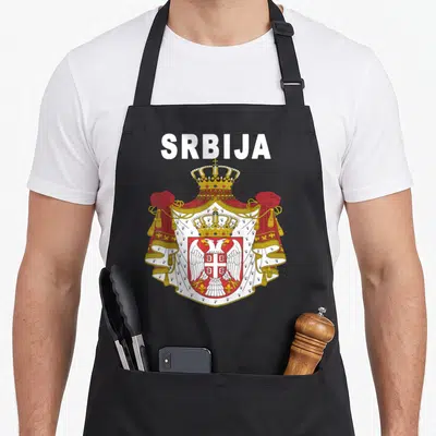 Serbian yugoslavia apron - White SRBIJA text above red gold white coat of arms on black background — shown on a black cotton canvas apron against a white background