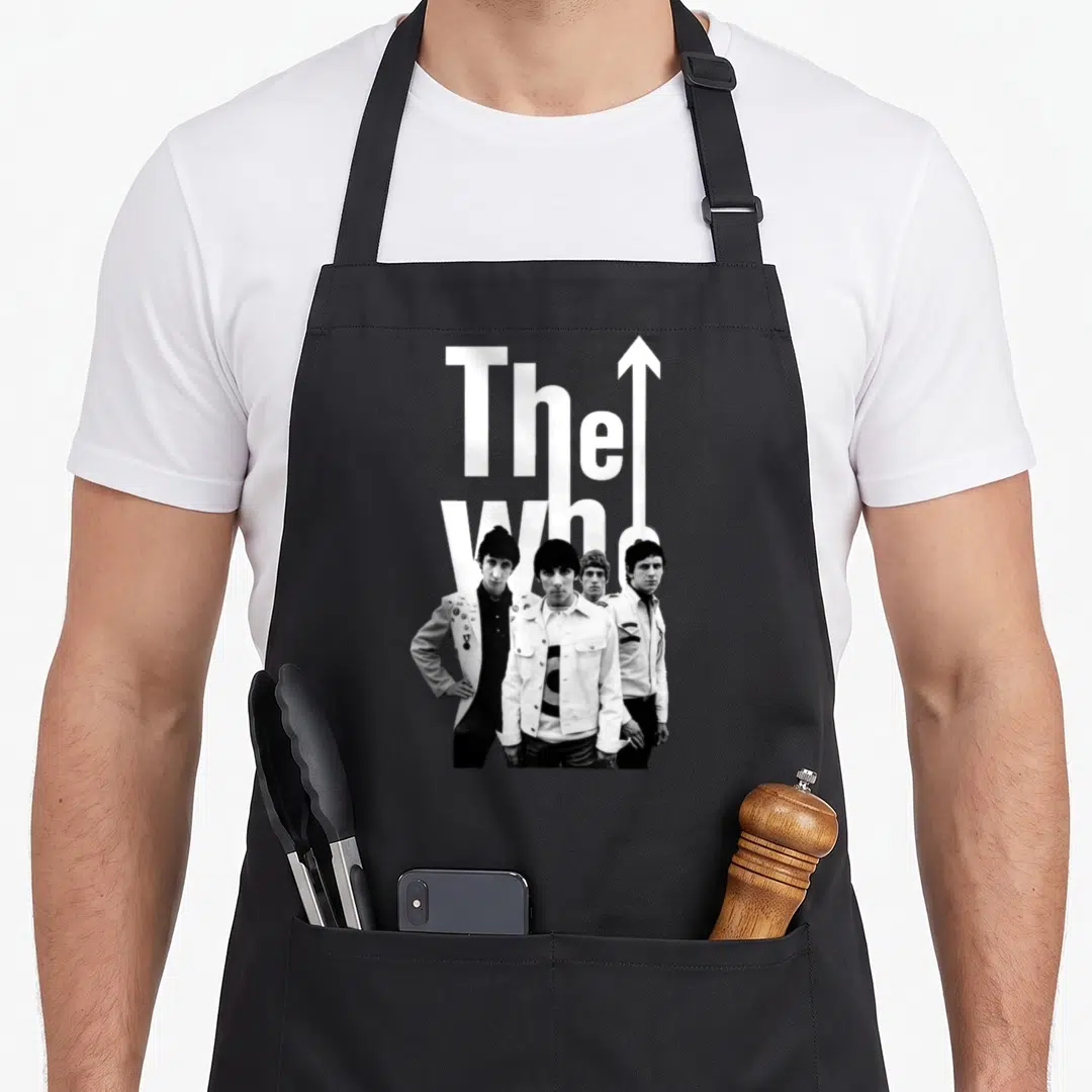 Band 60s apron - The Who text and four standing band members with upward arrow in black and white — shown on a black cotton canvas apron against a white background
