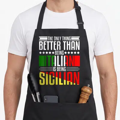 Better sicily apron - Stacked text reading THE ONLY THING BETTER THAN BEING ITALIAN IS BEING SICILIAN with flag colors — shown on a black cotton canvas apron against a white background