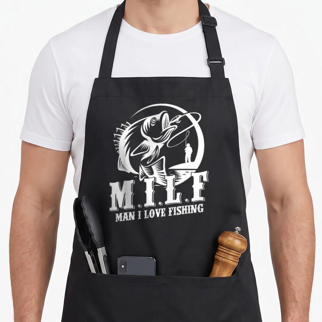 Milf fisherman fishing aprons - White line art of leaping fish and angler with text MAN I LOVE FISHING — shown on a black cotton canvas apron against a white background
