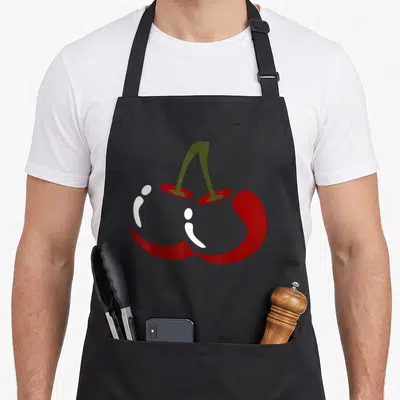 Cherry vegetable apron - Two red cherries connected by a stem in minimalist grey and olive art — shown on a black cotton canvas apron against a white background