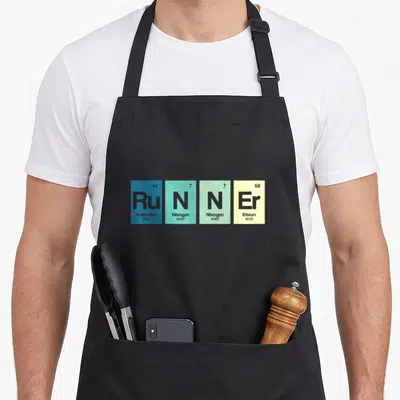 Funy table apron - Four colored tiles spelling Runner using Ruthenium Nitrogen Erbium periodic table data — shown on a black cotton canvas apron against a white background