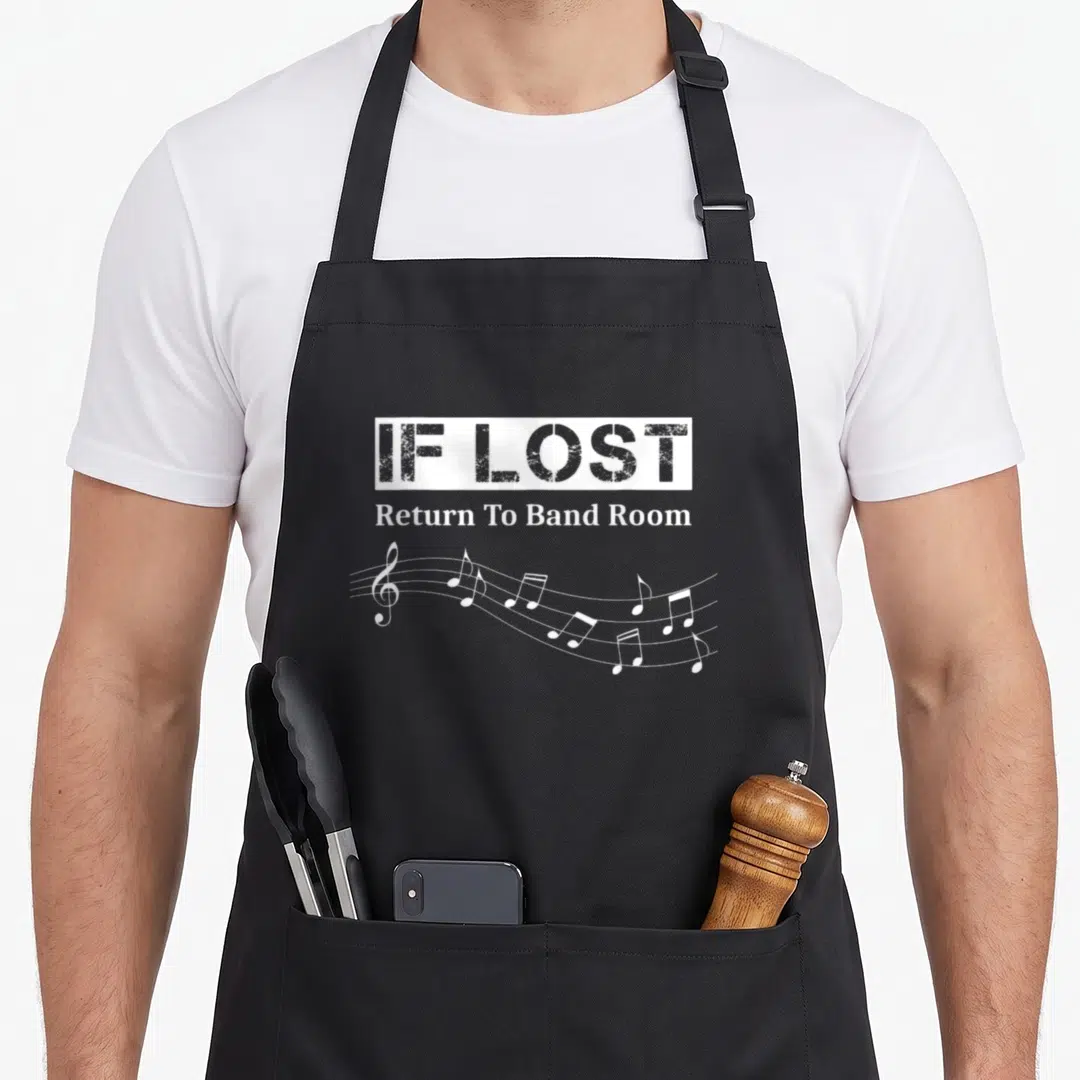 Lost marching band apron - White IF LOST text box above musical notes on staff lines — shown on a black cotton canvas apron against a white background