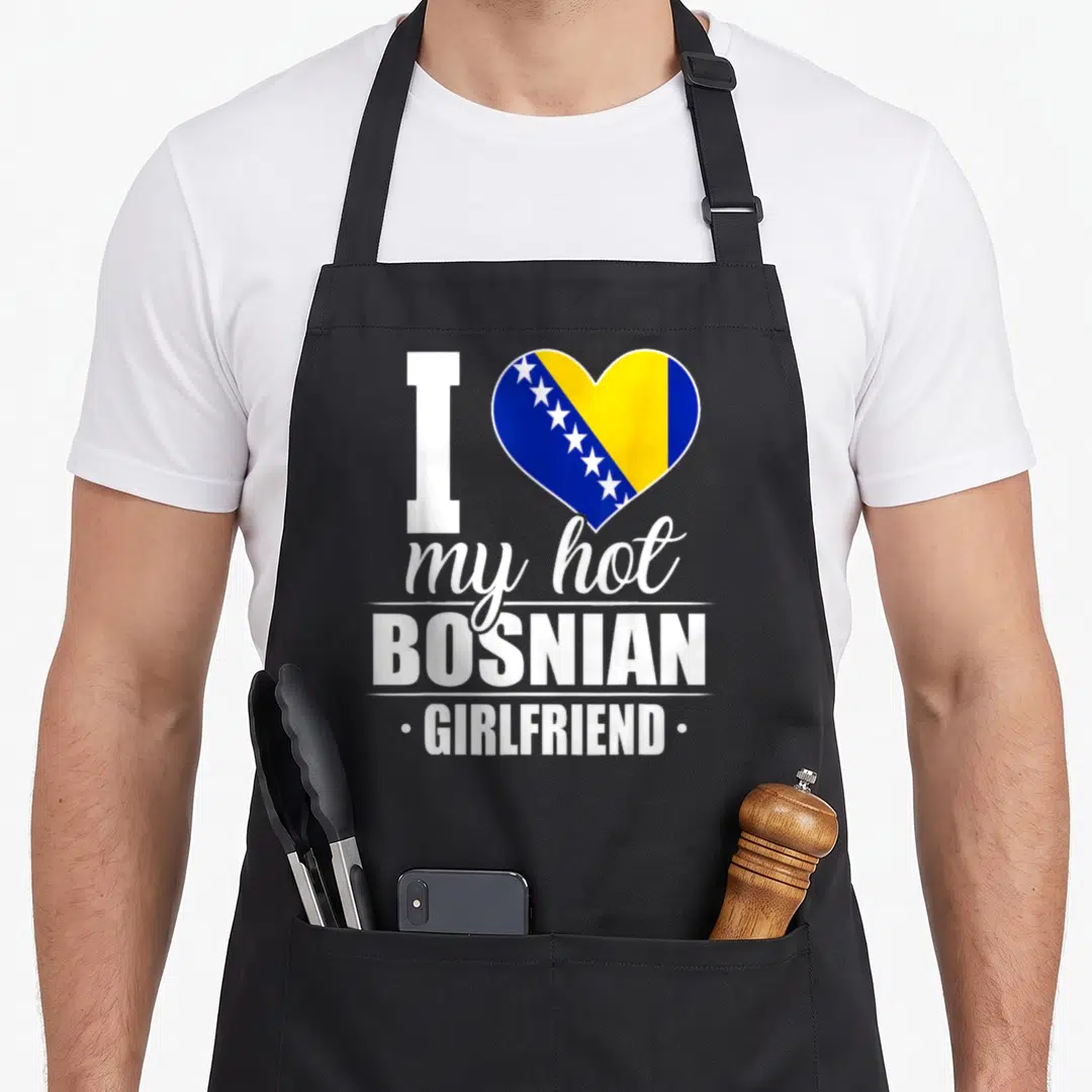 Hot bosnian girl apron - Heart with blue yellow flag and text I my hot BOSNIAN GIRLFRIEND — shown on a black cotton canvas apron against a white background