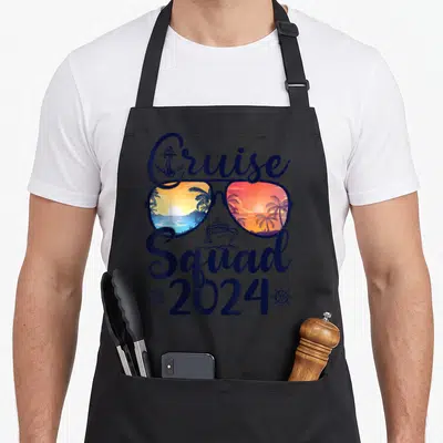 Squad summer vacation family aprons - Retro sunglasses with beach scenes, anchor, cruise ship, and two ship wheels — shown on a black cotton canvas apron against a white background