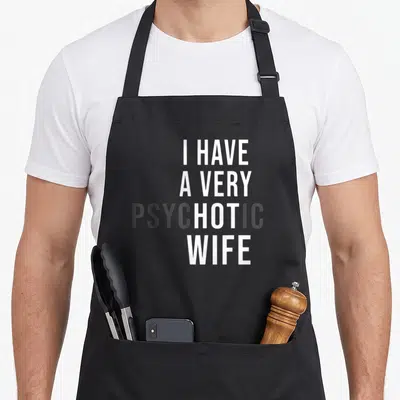 Hot wife apron - Stacked white and grey text reading I HAVE A VERY PSYCHOTIC WIFE on grey background — shown on a black cotton canvas apron against a white background