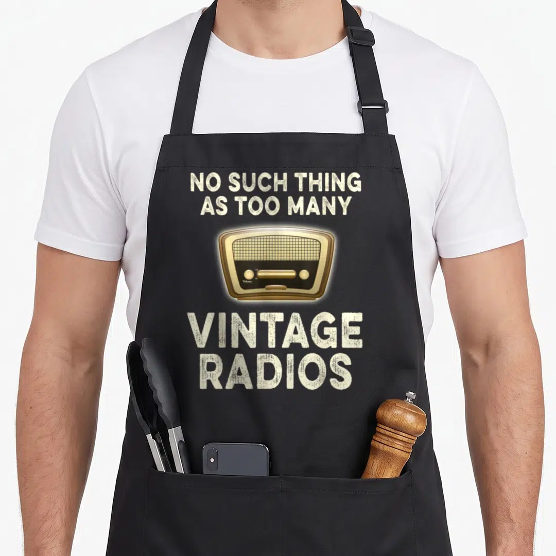 Radio antique apron - Vintage radio illustration between beige text reading No Such Thing As Too Many Vintage Radios — shown on a black cotton canvas apron against a white background