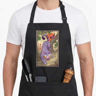 Derpy traditional apron - Purple cat, red sun, bird on branch, Korean text on left side — shown on a black cotton canvas apron against a white background