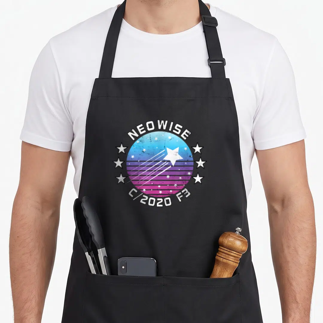 Neowise hunter apron - Retro comet badge with NEOWISE text, blue purple gradient circle, and six surrounding stars — shown on a black cotton canvas apron against a white background
