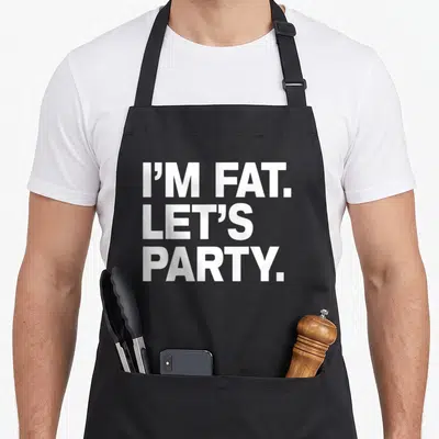 Drinking fat man in apron - White stacked text reading I'M FAT. LET'S PARTY — shown on a black cotton canvas apron against a white background
