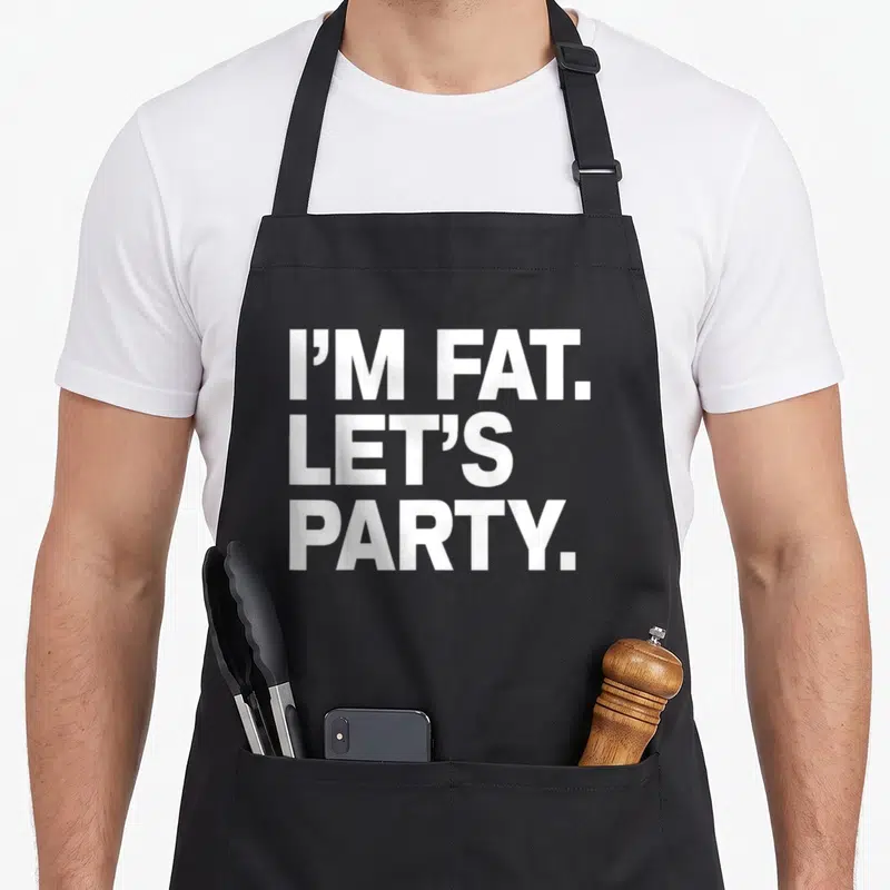 Drinking fat man in apron - White stacked text reading I'M FAT. LET'S PARTY — shown on a black cotton canvas apron against a white background