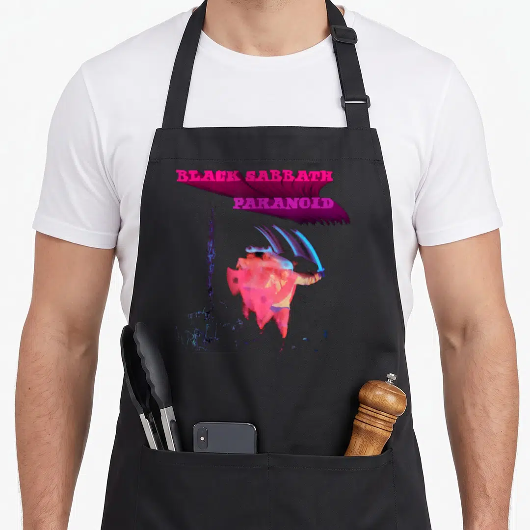 Paranoid black officially apron - Stacked magenta Black Sabbath Paranoid text above distorted red and blue figure — shown on a black cotton canvas apron against a white background
